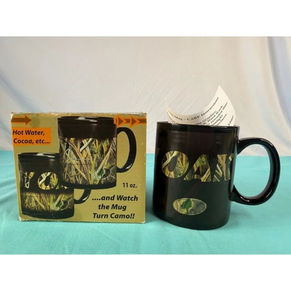 Black ceramic color-changing coffee mug that reveals a Mossy Oak camouflage